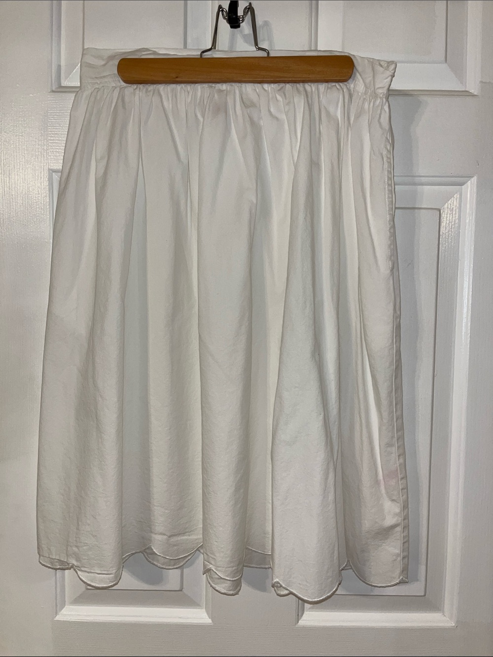 The Tiny Tassel scallop hem midi skirt